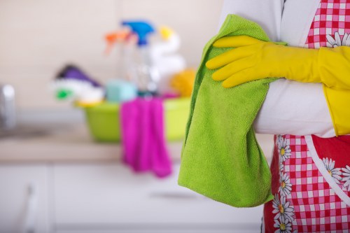 Cleaning team using products safely during a routine task